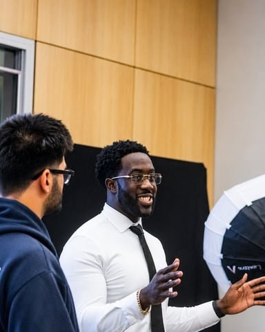 Ezekiel K. Bissah speaking with attendees after the workshop