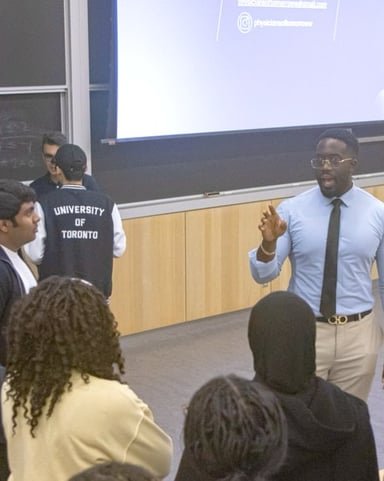 Ezekiel K. Bissah speaking with students after the panel